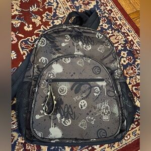A Young Man’s Stylish Black and Gray Backpack by Art Class